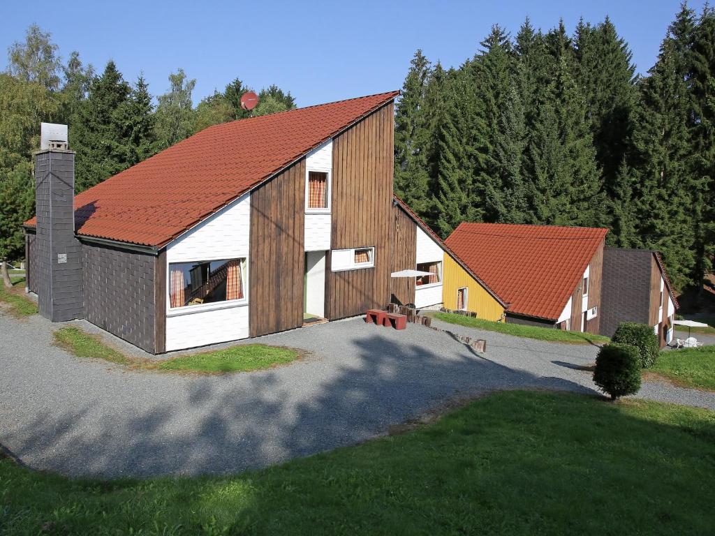 a rendering of a house with a red roof at Charmantes Ferienhaus in Skigebietsnähe in Schmallenberg