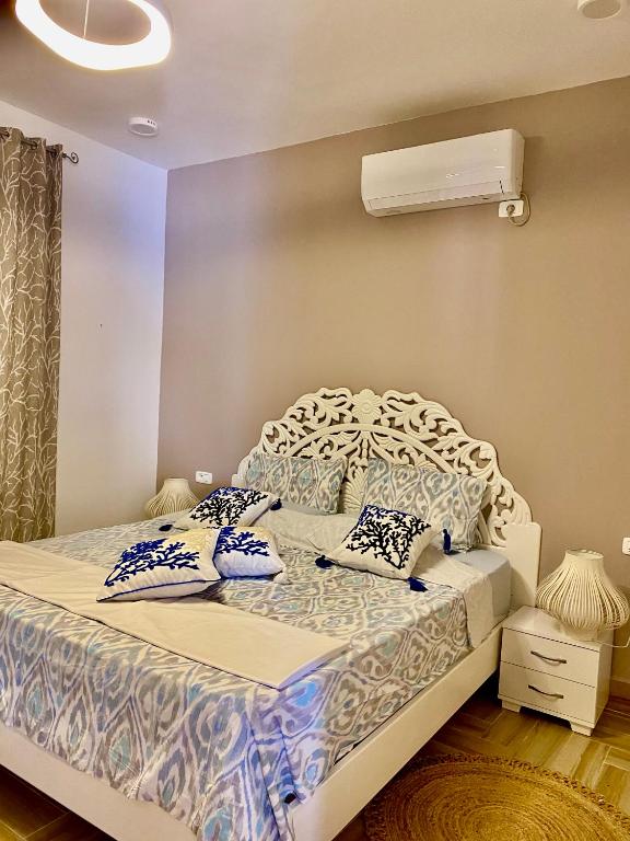 Postel nebo postele na pokoji v ubytování Villa Papaya - Djerba
