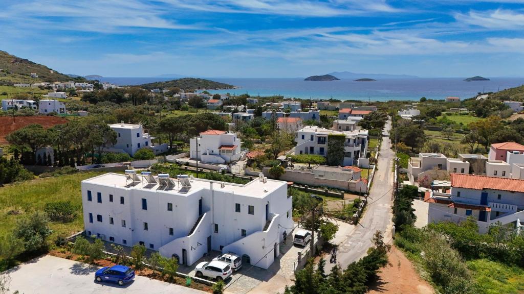 an aerial view of a town with a white building at Ateni House Garden in Agios Petros