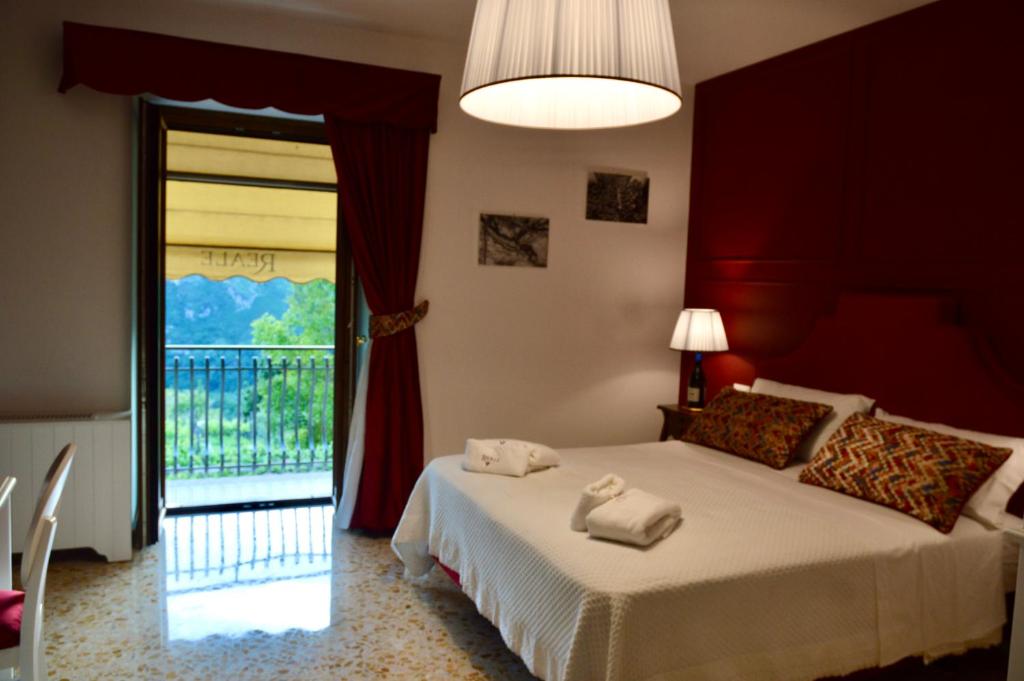 Postel nebo postele na pokoji v ubytování Reale Wine Resort