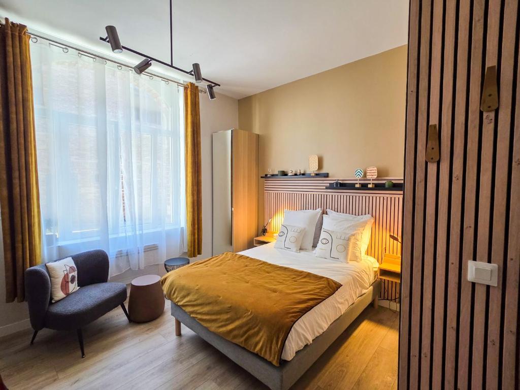 Fotografia z galérie ubytovania Les Appartements de la Nef d'Or - Studio Elégant et Lumineux v destinácii Saint-Quentin