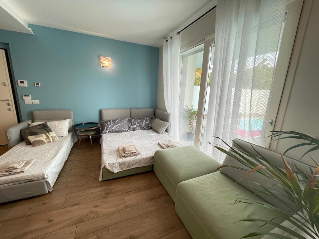 Łóżko lub łóżka w pokoju w obiekcie Appartamento in città con Giardino e Piscina privati