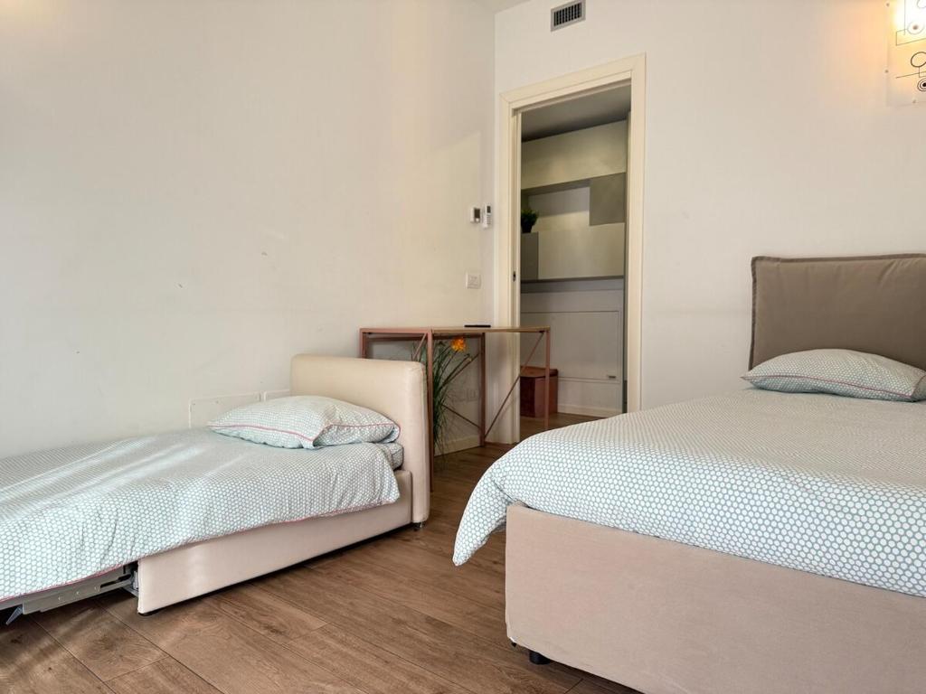 Łóżko lub łóżka w pokoju w obiekcie Appartamento in città con Giardino e Piscina privati