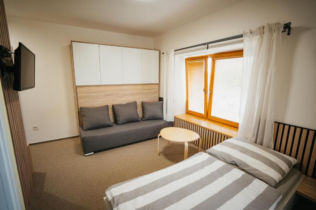 Postel nebo postele na pokoji v ubytování Penzion Tsport