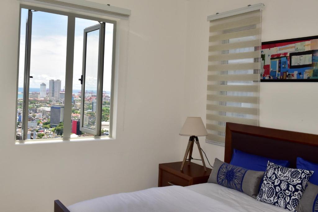 Postel nebo postele na pokoji v ubytování SkyLounge Apartment Colombo