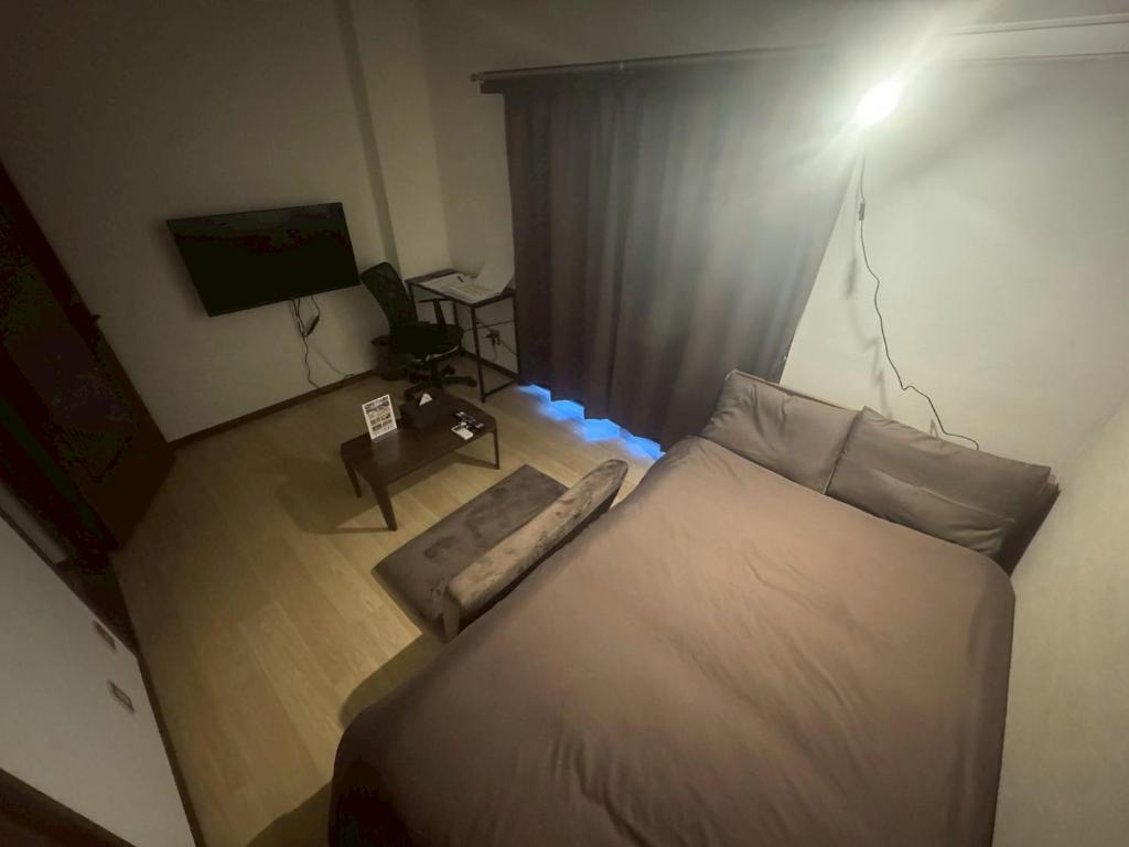 Postel nebo postele na pokoji v ubytování Apartment Hotel Kuki