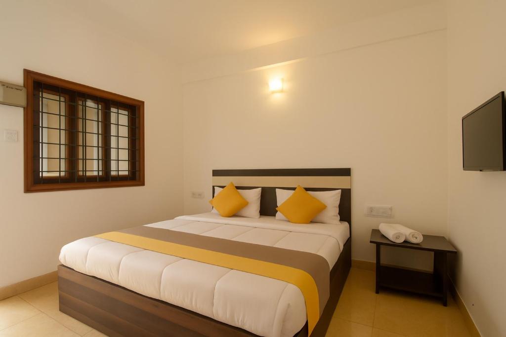 Postel nebo postele na pokoji v ubytování XRP Candolim Holidays