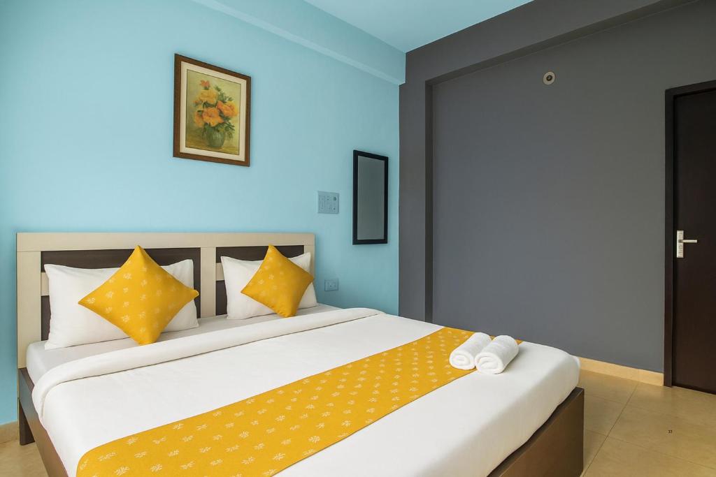 Postel nebo postele na pokoji v ubytování XRP Candolim Holidays