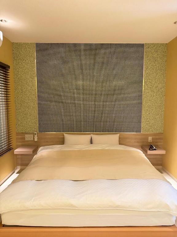 Hotel JOYCEにあるベッド