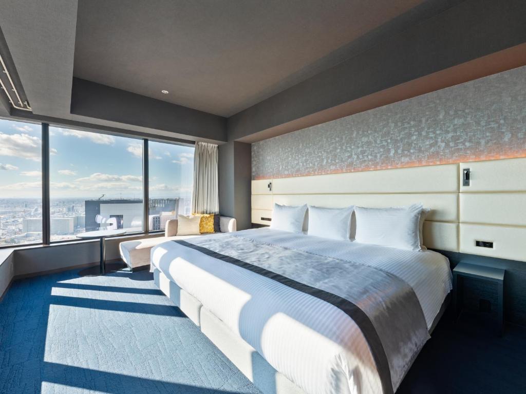 Postel nebo postele na pokoji v ubytování Mitsui Garden Hotel Nagoya Premier