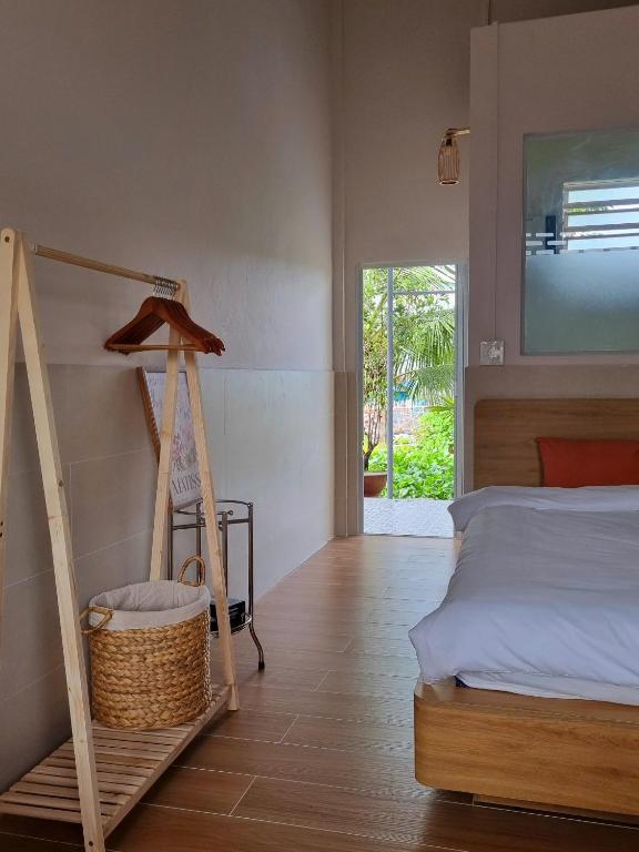 Postel nebo postele na pokoji v ubytování Tran Phu Riverside House
