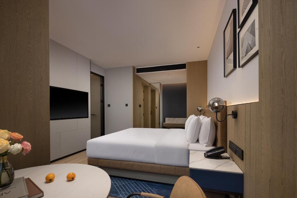 TV a/nebo společenská místnost v ubytování Four Points by Sheraton Kunming Dongfeng Square
