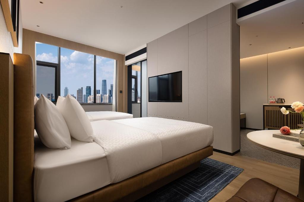 Postel nebo postele na pokoji v ubytování Four Points by Sheraton Kunming Dongfeng Square