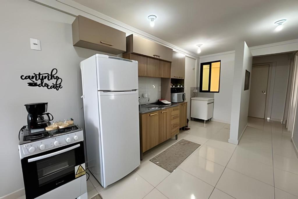 Kuchyň nebo kuchyňský kout v ubytování Edifício com Ótima localização e Conforto