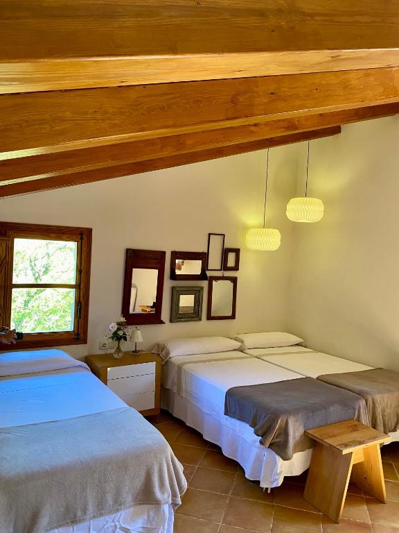 Postel nebo postele na pokoji v ubytování La Casa de Los Moyas