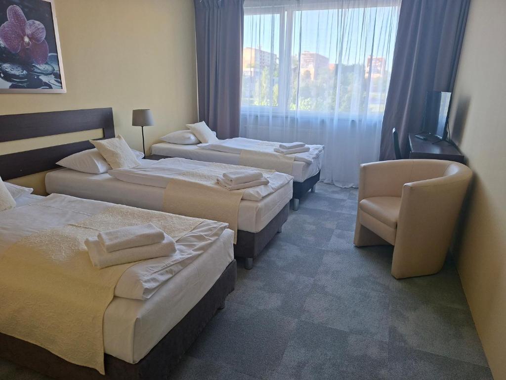 Postel nebo postele na pokoji v ubytování Hotel Cascade