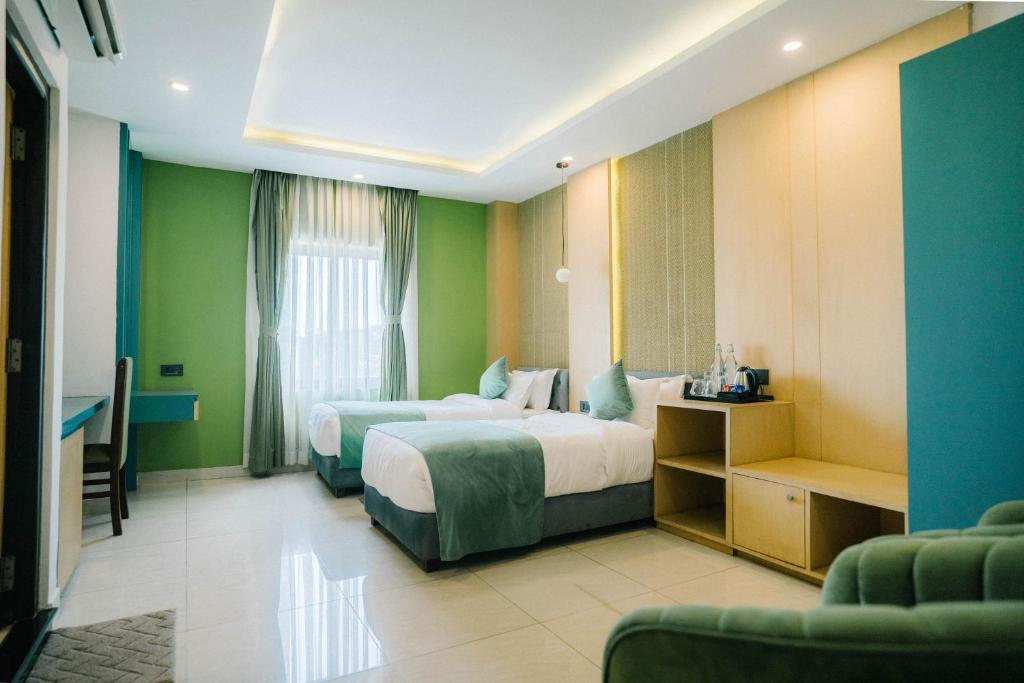 Postel nebo postele na pokoji v ubytování Hotel Aikawa