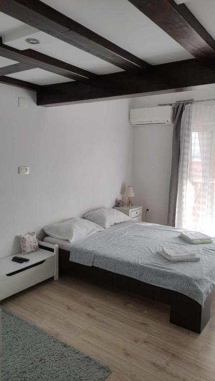 Postel nebo postele na pokoji v ubytování Apartman Tihana