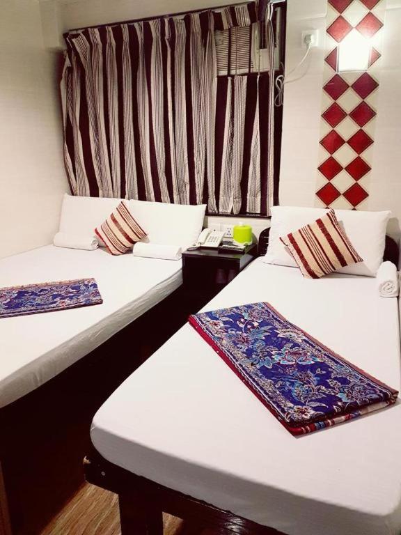 Postel nebo postele na pokoji v ubytování Toronto Motel Hk
