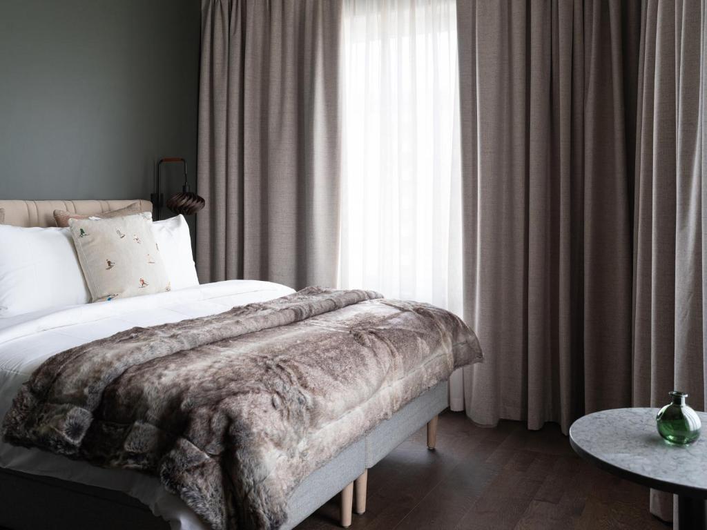 Postel nebo postele na pokoji v ubytování Elite Hotel Frost - Hotel & Spa