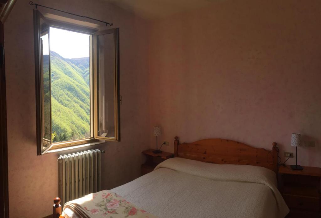 Postel nebo postele na pokoji v ubytování Albergo Ristorante La Selva