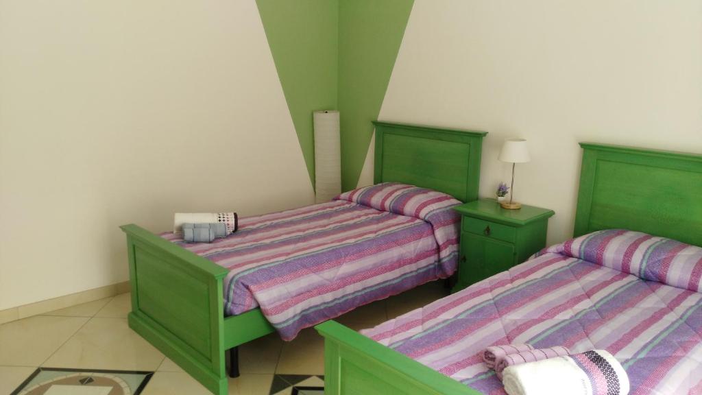 Postel nebo postele na pokoji v ubytování B&b Sa Zodia Guest House