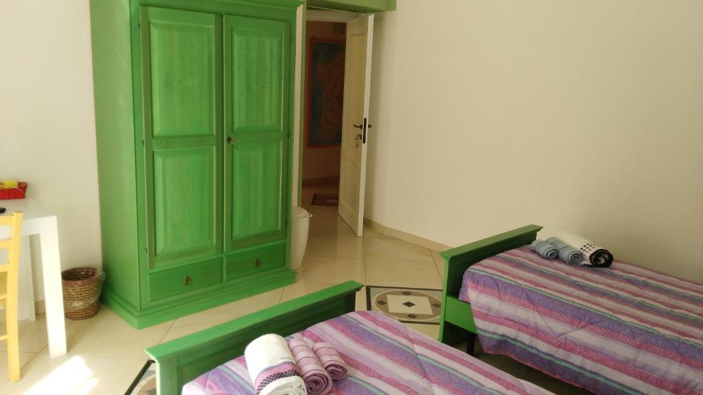 Postel nebo postele na pokoji v ubytování B&b Sa Zodia Guest House