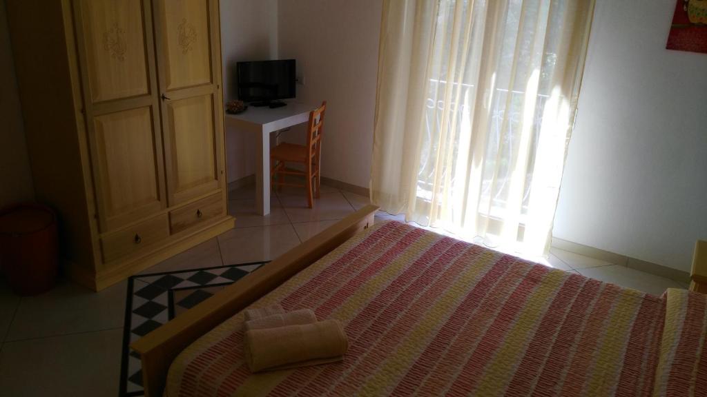 Postel nebo postele na pokoji v ubytování B&b Sa Zodia Guest House