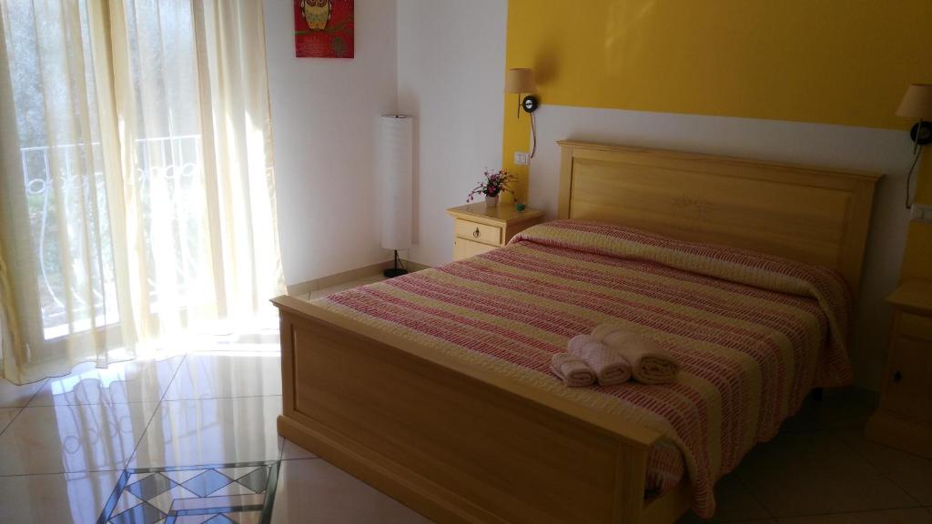 Postel nebo postele na pokoji v ubytování B&b Sa Zodia Guest House