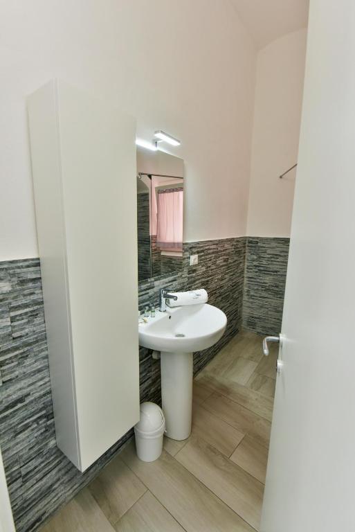 a bathroom with a sink and a mirror at VILLA IRMA in Varigotti