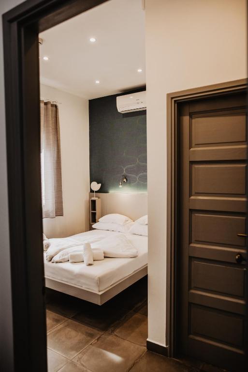 Postel nebo postele na pokoji v ubytování Fészek -Étel és Hotel-