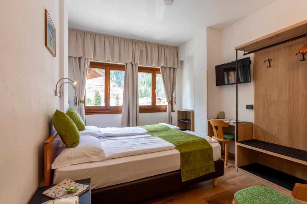 Postel nebo postele na pokoji v ubytování Hotel Oswald