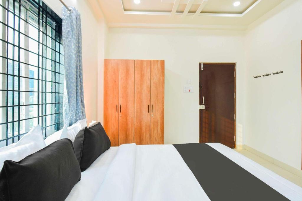 Postel nebo postele na pokoji v ubytování Super Townhouse Kokapet Near GAR