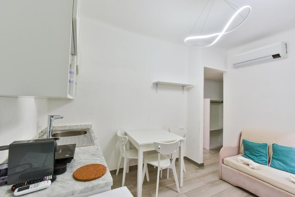 a living room with a couch and a table at VILLA IRMA in Varigotti