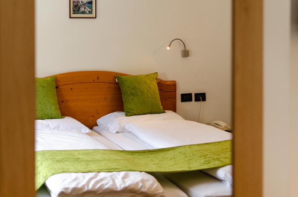 Postel nebo postele na pokoji v ubytování Hotel Oswald
