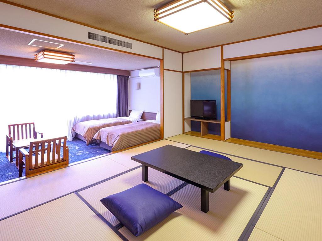 Postel nebo postele na pokoji v ubytování Ooedo Onsen Monogatari Premium Kinugawa Kanko Hotel
