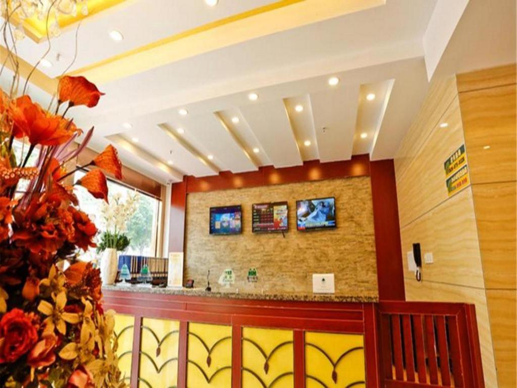 a lobby with a bar in a building at GreenTree Inn Zhenjiang Center Street No.1 Peoples Hospital Express Hotel in Zhenjiang