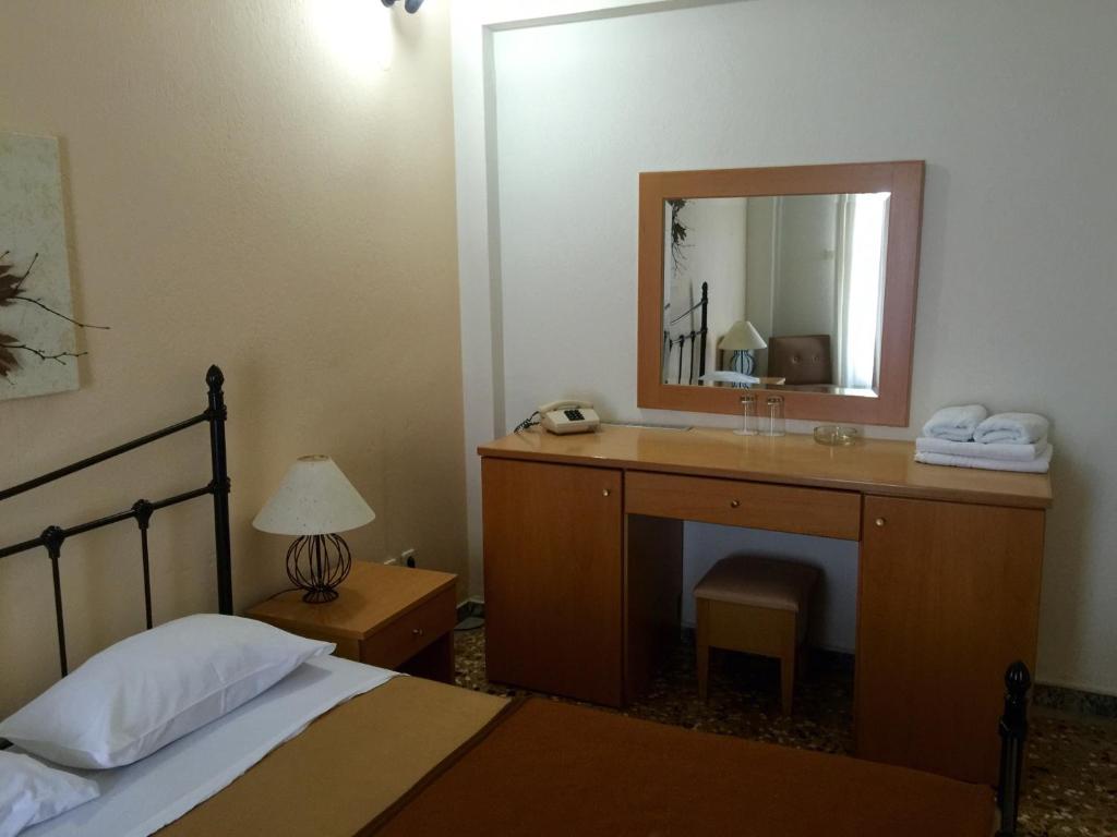 Postel nebo postele na pokoji v ubytování Hotel Markos