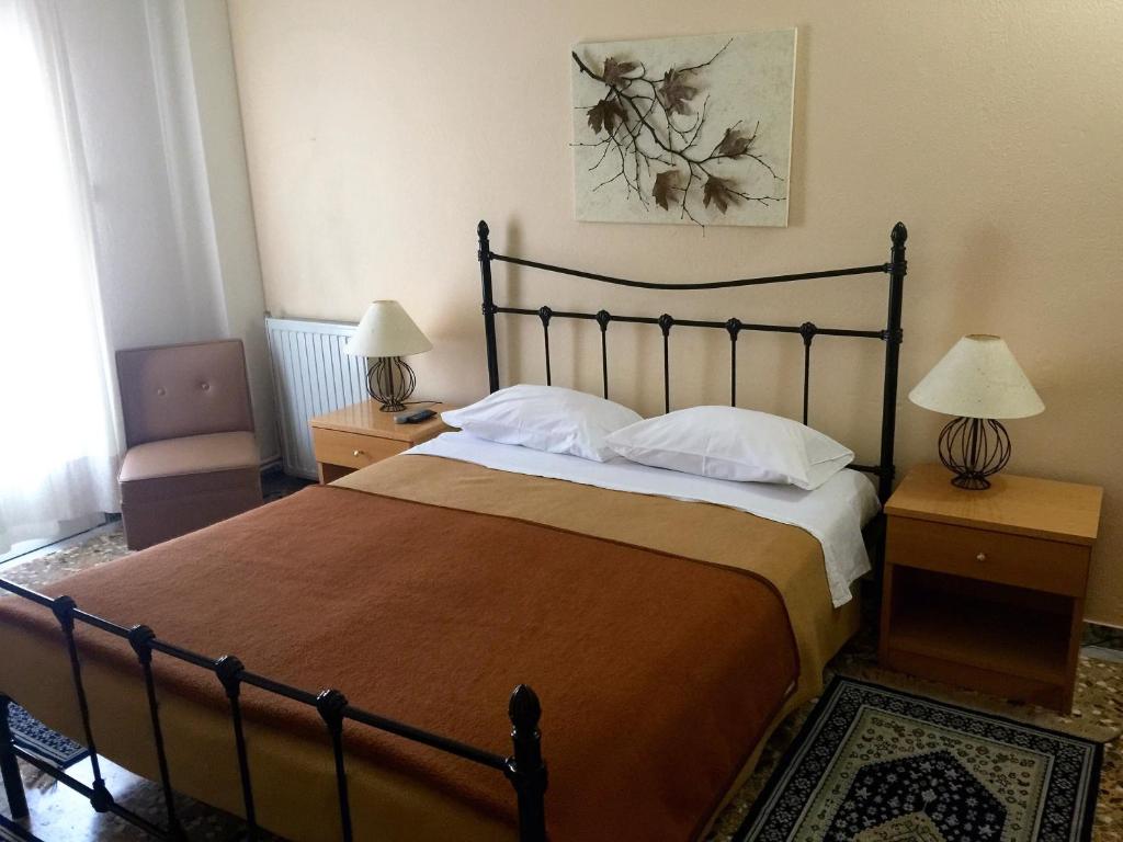 Postel nebo postele na pokoji v ubytování Hotel Markos