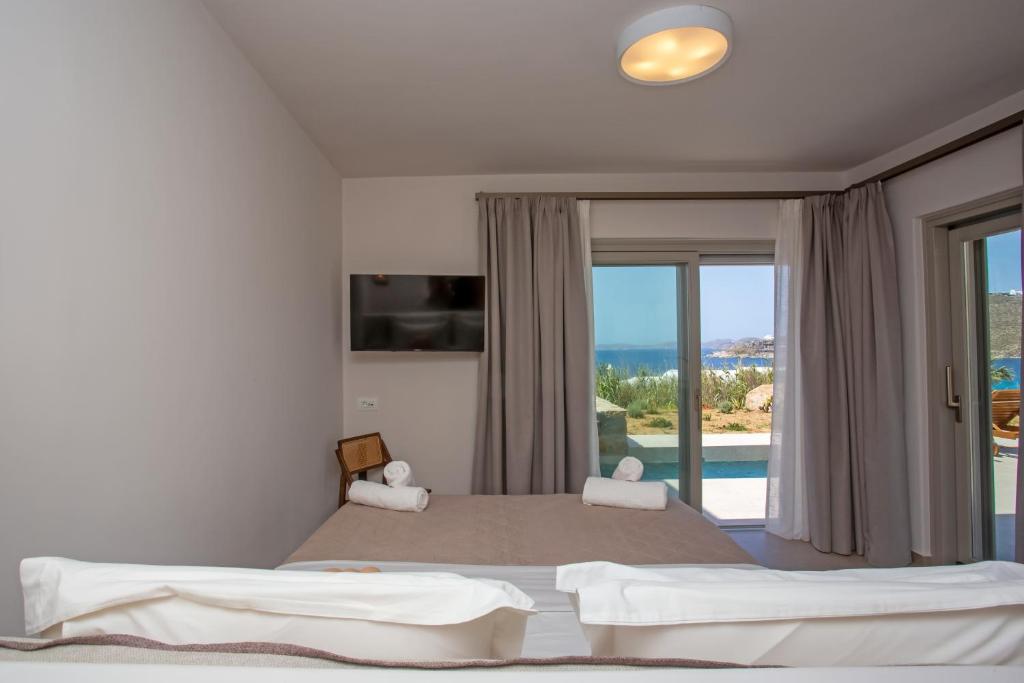 A bed or beds in a room at Only yours , Mykonos