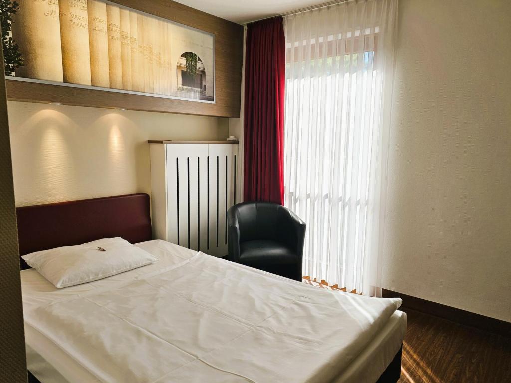 Postel nebo postele na pokoji v ubytování Arvena Park Hotel