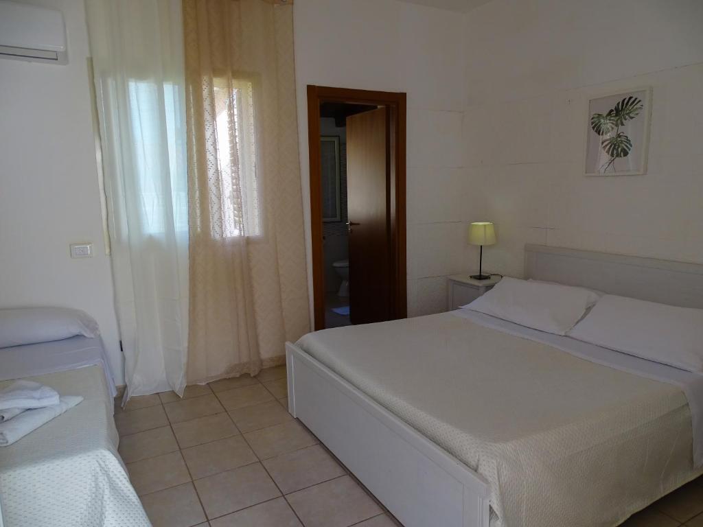 Posteľ alebo postele v izbe v ubytovaní B&B Villa Matari