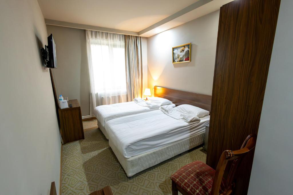 Postel nebo postele na pokoji v ubytování Gyumri Hotel
