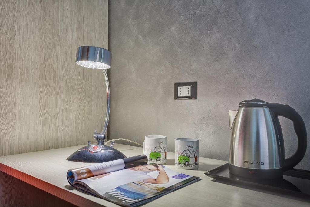 Příslušenství pro přípravu čaje a kávy v ubytování Excellence Suite