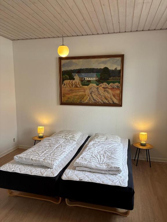 Katil atau katil-katil dalam bilik di Djursland Lystrup Strand Ferieboliger