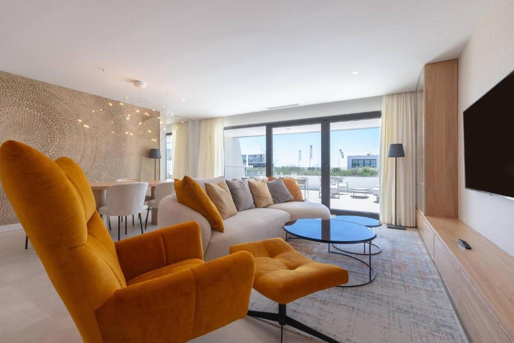 a living room with a couch and a tv at EL Eden casa 71 in Málaga