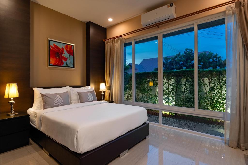 Postel nebo postele na pokoji v ubytování Luxury Pool villa C16 / 4BR 8-10 Persons