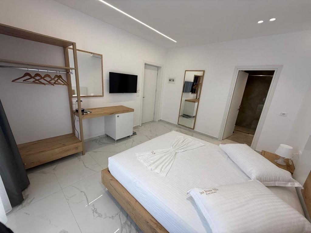 Postel nebo postele na pokoji v ubytování Sea Breeze Villa