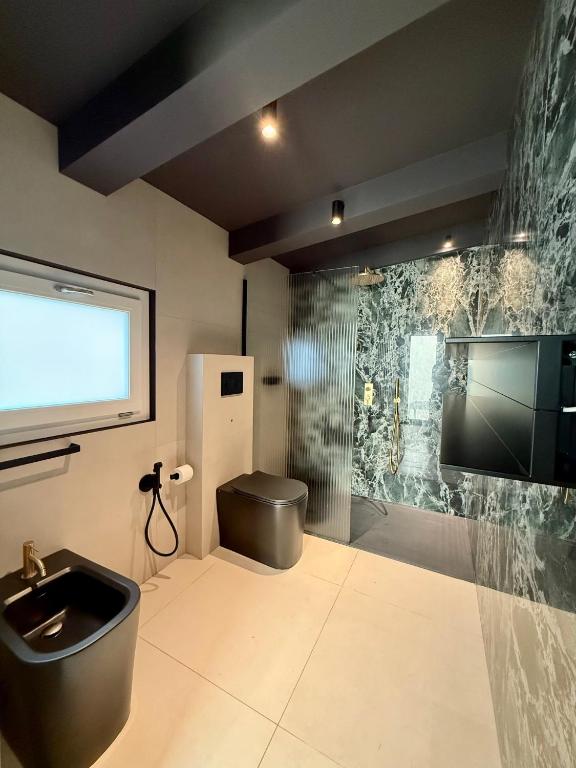 TV a/nebo společenská místnost v ubytování Memento B&B