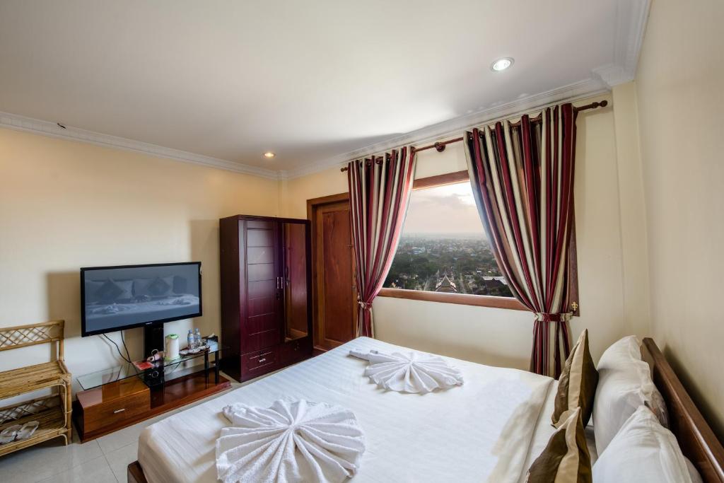 Postel nebo postele na pokoji v ubytování Seng Hout Hotel